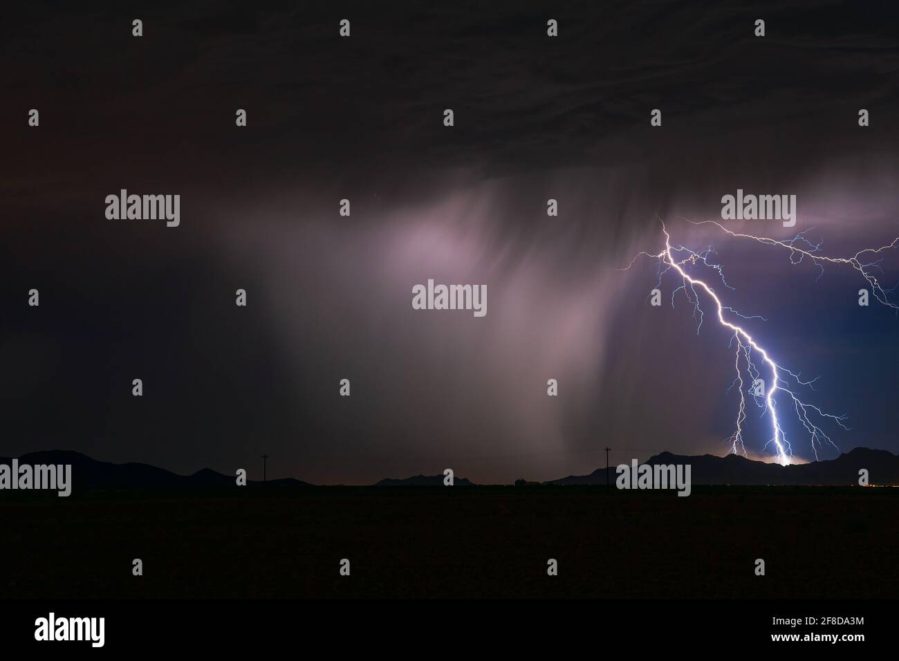 Lightning bolt strike from a monsoon storm near Casa Grande, Arizona Stock Photo
