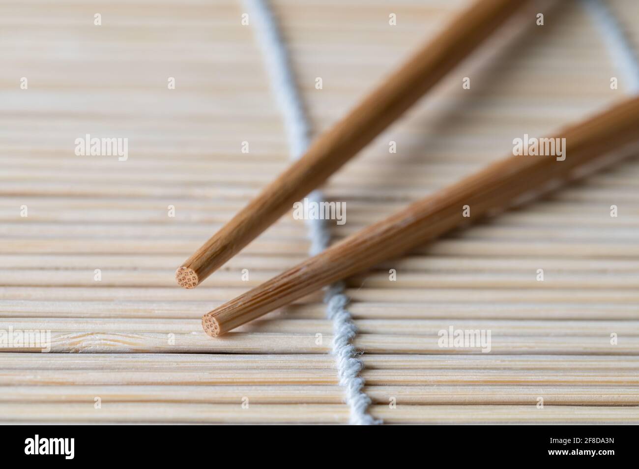 Chopsticks on a Bamboo Mat Stock Photo