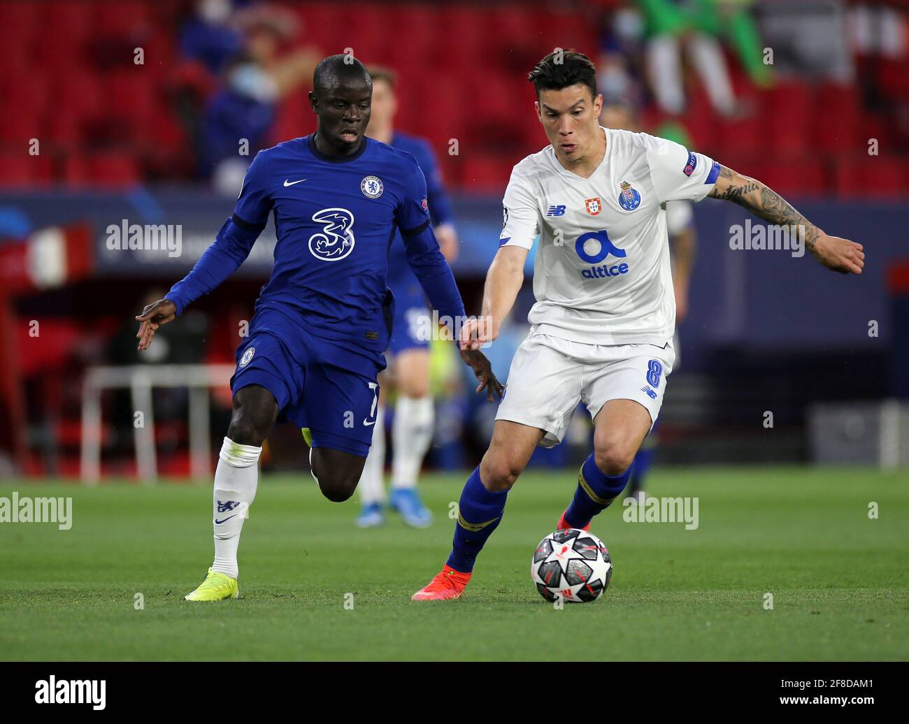 Chelsea's N'Golo Kante (left) and FC Porto's Mateus Uribe battle for the ball during the UEFA Champions League match at the Ramon Sanchez-Pizjuan Stadium, Seville. Picture date: Tuesday April 13, 2021. See PA story SOCCER Chelsea. Photo credit should read: Isabel Infantes/PA Wire. RESTRICTIONS: Editorial use only, no commercial use without prior consent from rights holder. Stock Photo