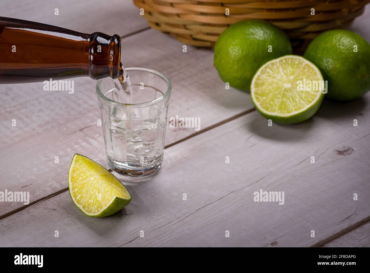 Bottle of pouring sugarcane liquor, a strong typical Brazilian alcoholic drink similar to rum