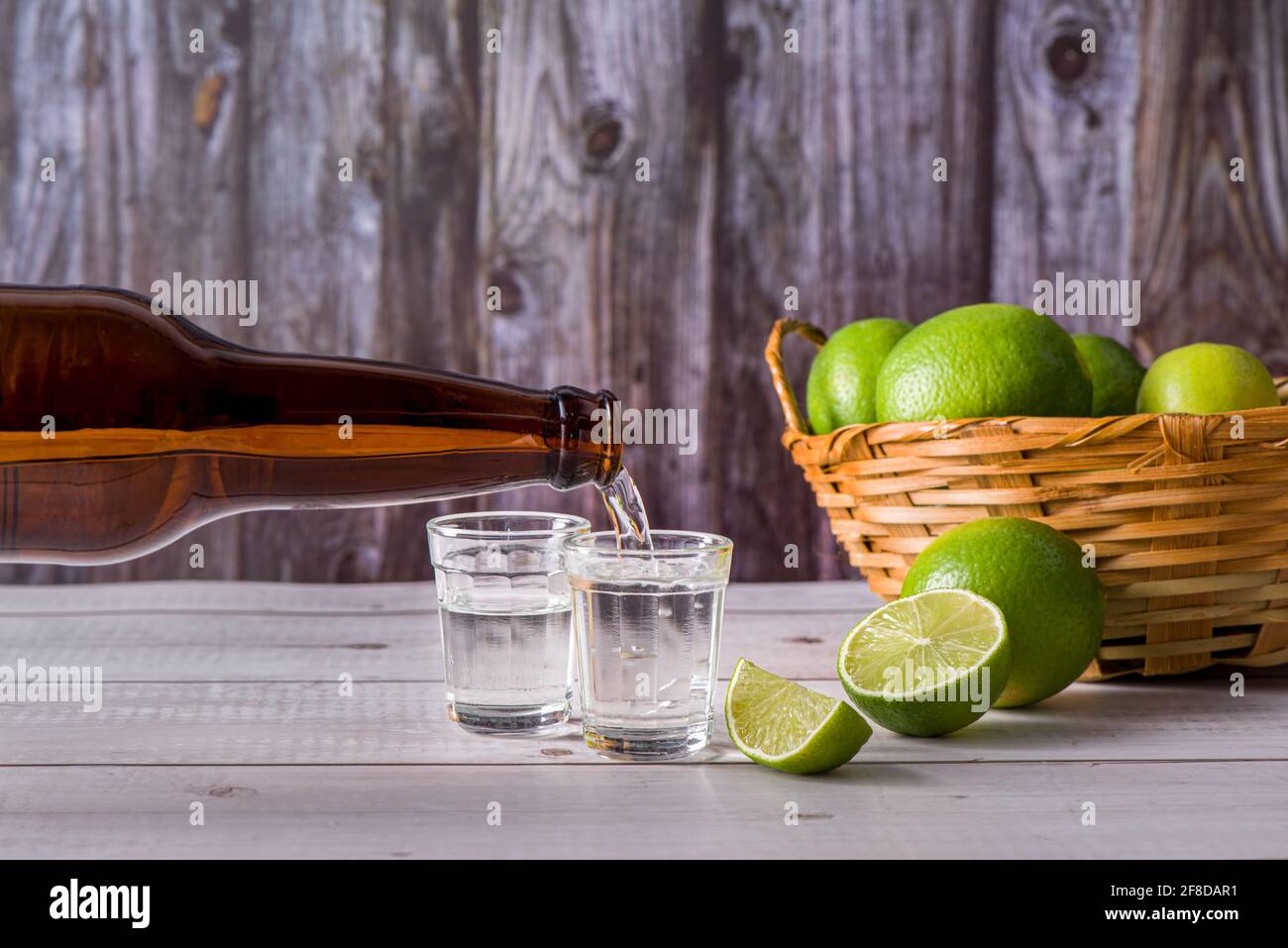 Bottle of pouring sugarcane liquor, a strong typical Brazilian alcoholic drink similar to rum