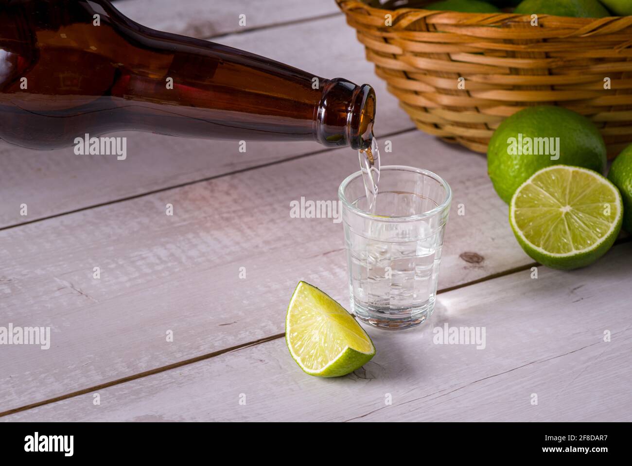 Bottle of pouring sugarcane liquor, a strong typical Brazilian alcoholic drink similar to rum