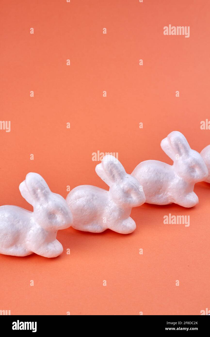 Sequence of white rabbits. Vertical shot of bunnies collection Stock