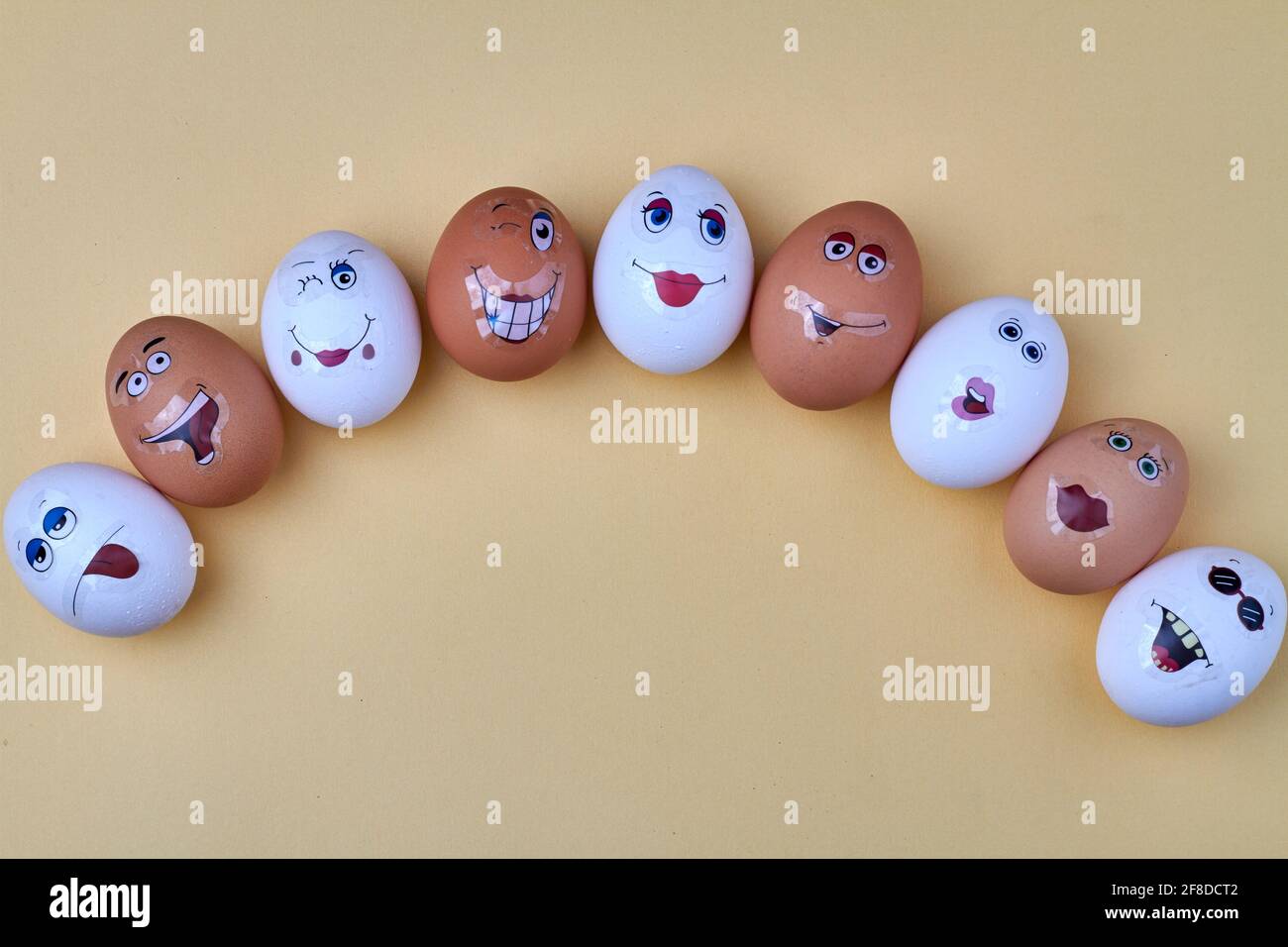 White easter eggs with funny faces. Stock Photo
