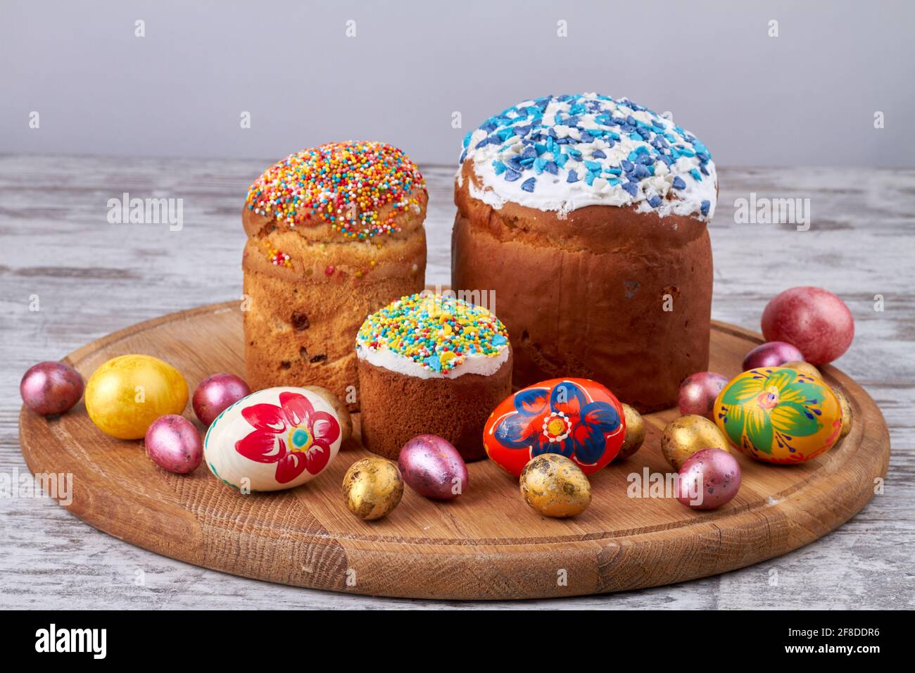 Still life easter cakes and eggs on wooden board. Stock Photo
