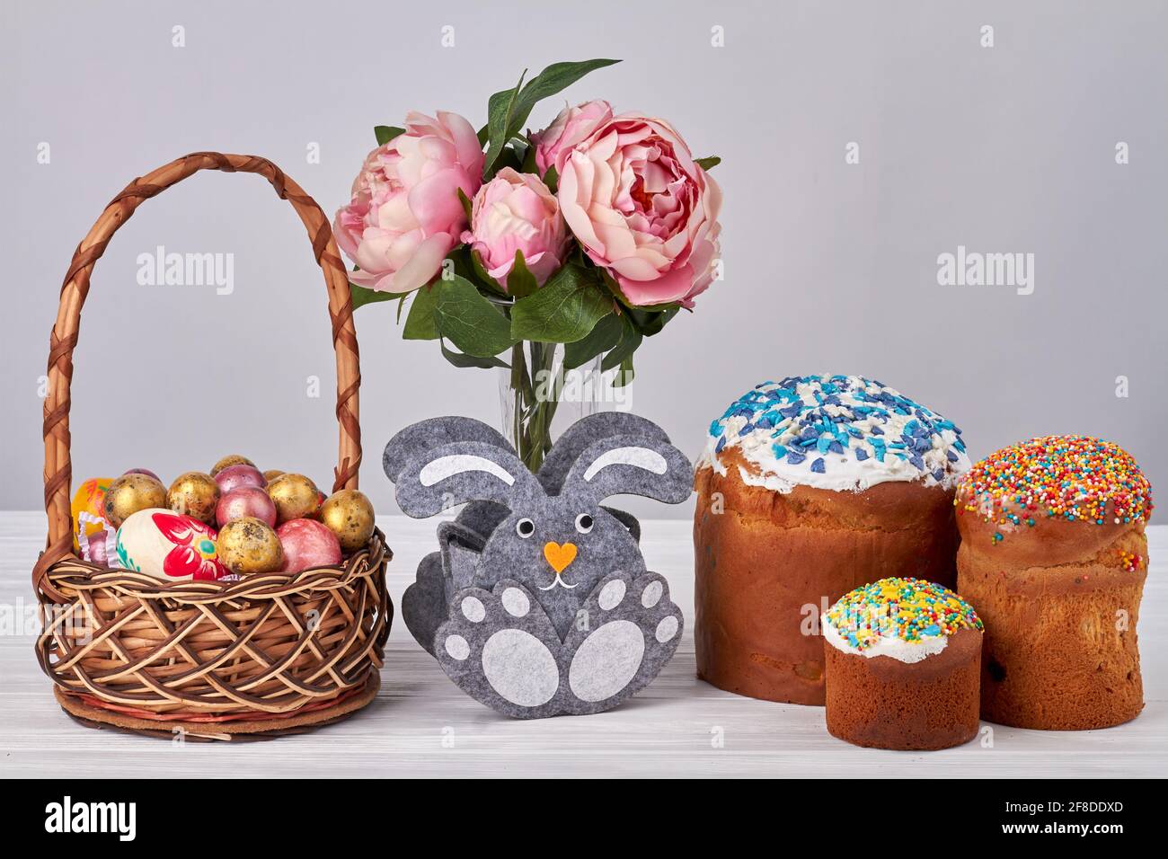 Flower vase with bunny with easter eggs and cakes Stock Photo - Alamy