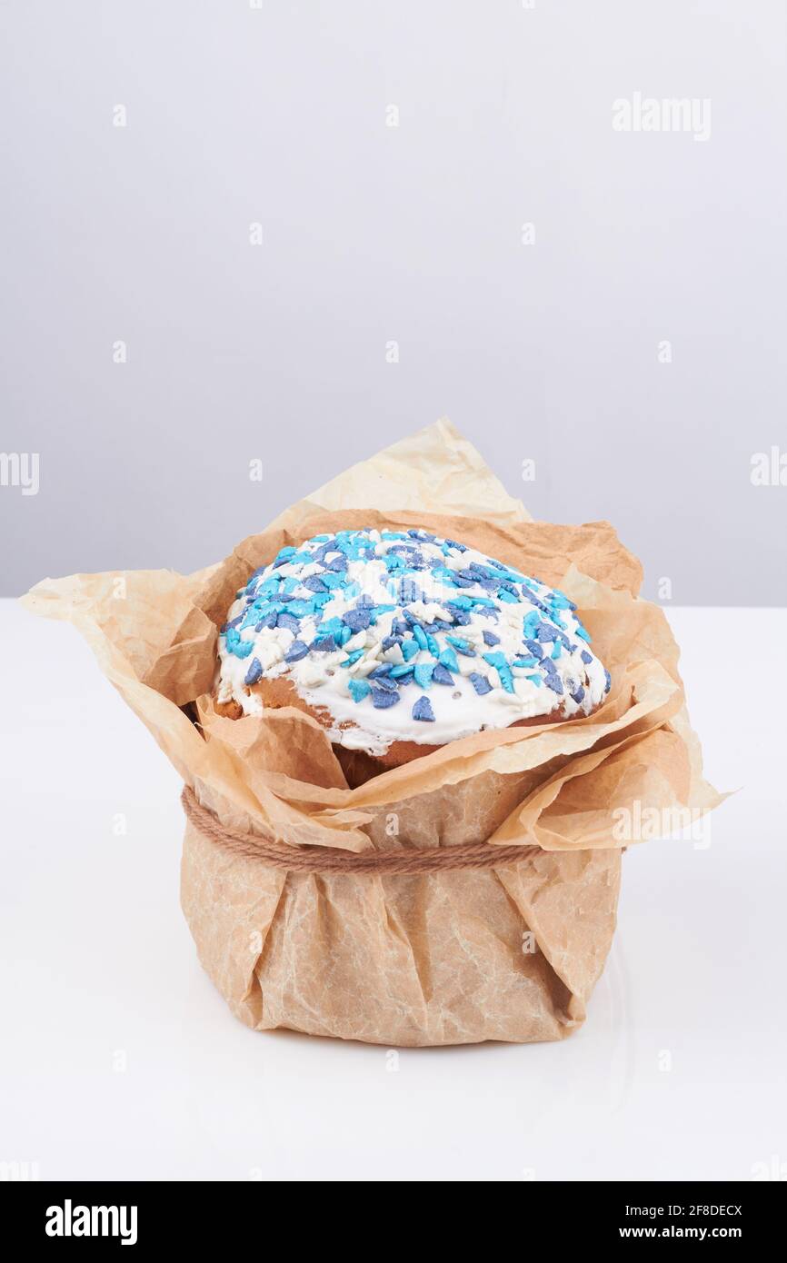 Easter cake wrapped in paper. Stock Photo
