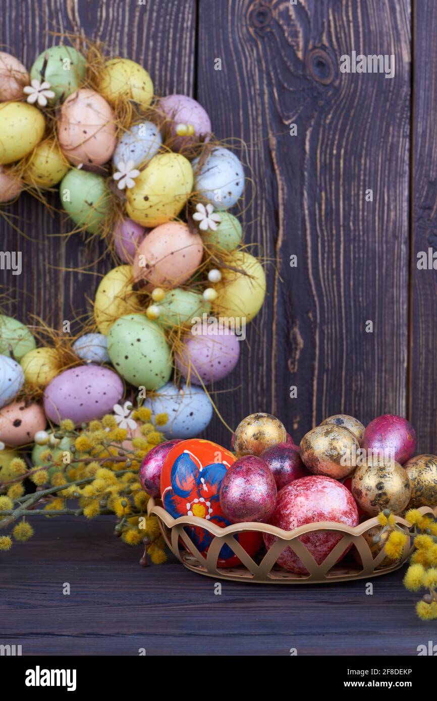 Colored easter eggs and yellow willow branch. Stock Photo