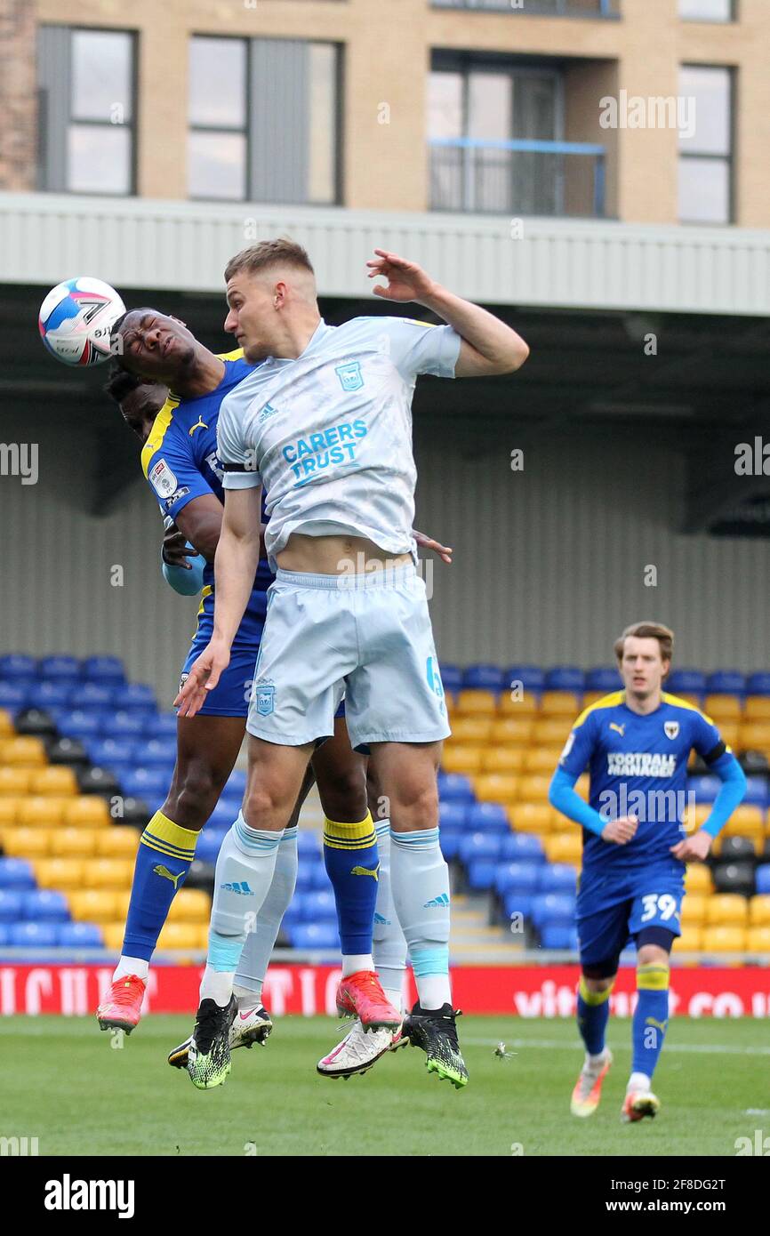 London, UK. 13th Apr, 2021. Paul Kalambayi of AFC Wimbledon and Luke Woolfenden of Ipswich Town compete for the ball during the EFL Sky Bet League 1 match between AFC Wimbledon and Ipswich Town at Plough Lane, London, England on 13 April 2021. Photo by Carlton Myrie. Editorial use only, license required for commercial use. No use in betting, games or a single club/league/player publications. Credit: UK Sports Pics Ltd/Alamy Live News Stock Photo