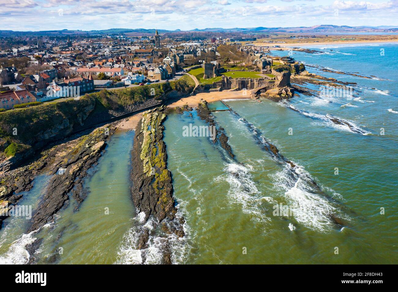 Aerial view from drone of St Andrews town and St Andrews Castle, Fife, Scotland, UK and Stock Photo