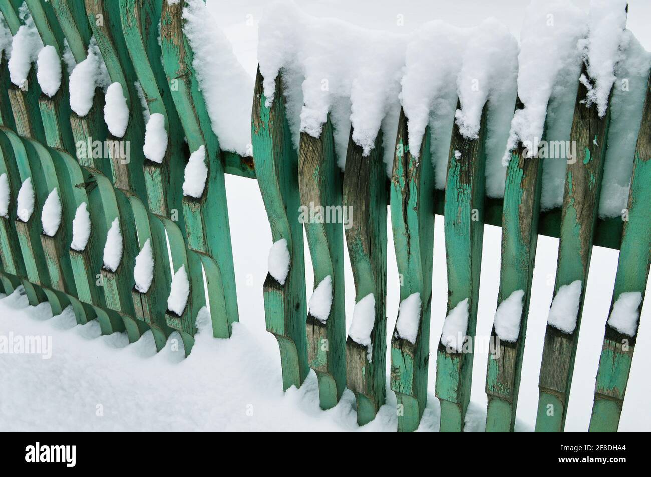 Old dilapidated wooden fence covered with snow Stock Photo - Alamy