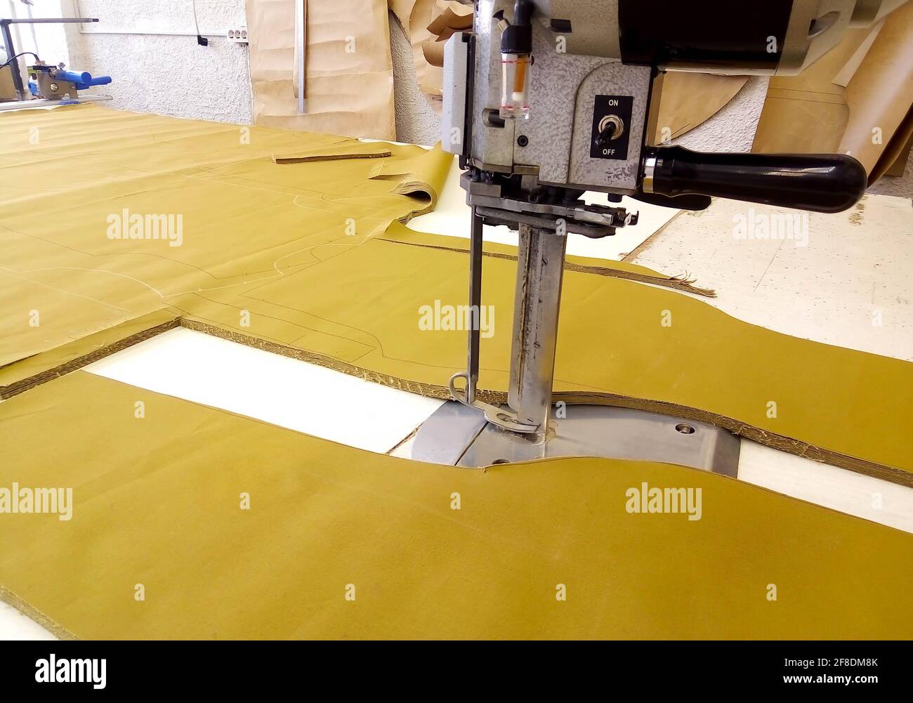 Tool cutter in the garment industry. Cutting parts of clothing with an