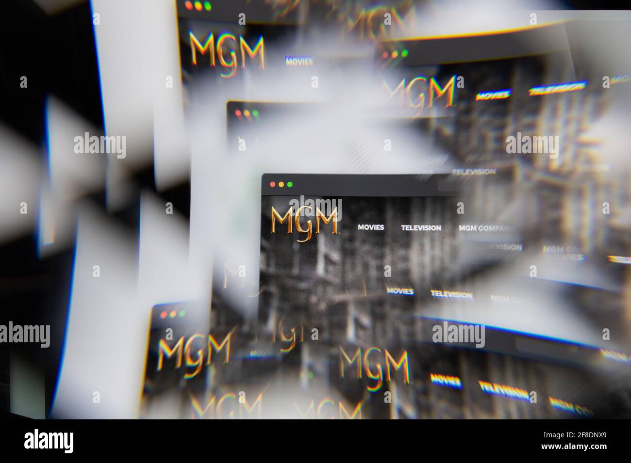 Milan, Italy - APRIL 10, 2021: MGM logo on laptop screen seen through an optical prism. Illustrative editorial image from MGM website. Stock Photo