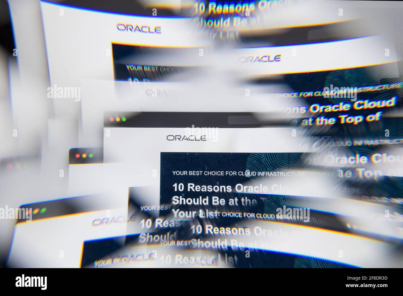 Milan, Italy - APRIL 10, 2021: Oracle service cloud logo on laptop screen seen through an optical prism. Illustrative editorial image from Oracle serv Stock Photo