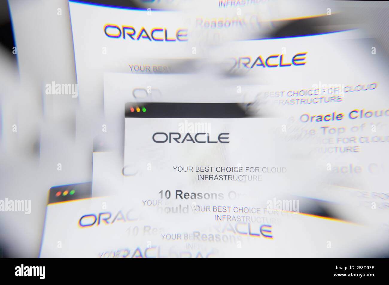 Milan, Italy - APRIL 10, 2021: Oracle service cloud logo on laptop screen seen through an optical prism. Illustrative editorial image from Oracle serv Stock Photo