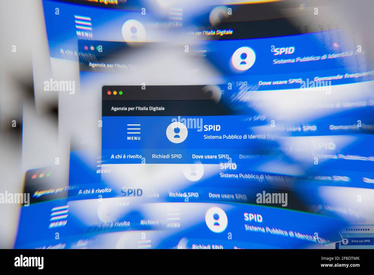 Milan, Italy - APRIL 10, 2021: spid identità digitale logo on laptop screen seen through an optical prism. Illustrative editorial image from spid ide Stock Photo