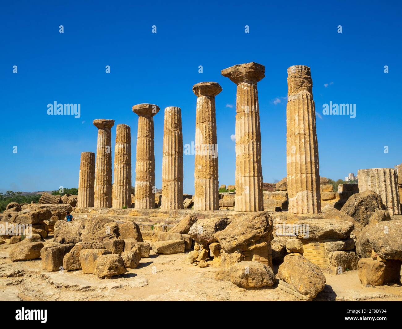 Doric Order columns standing by other remains of the Temple of Heracles in Valle dei Templi Stock Photo