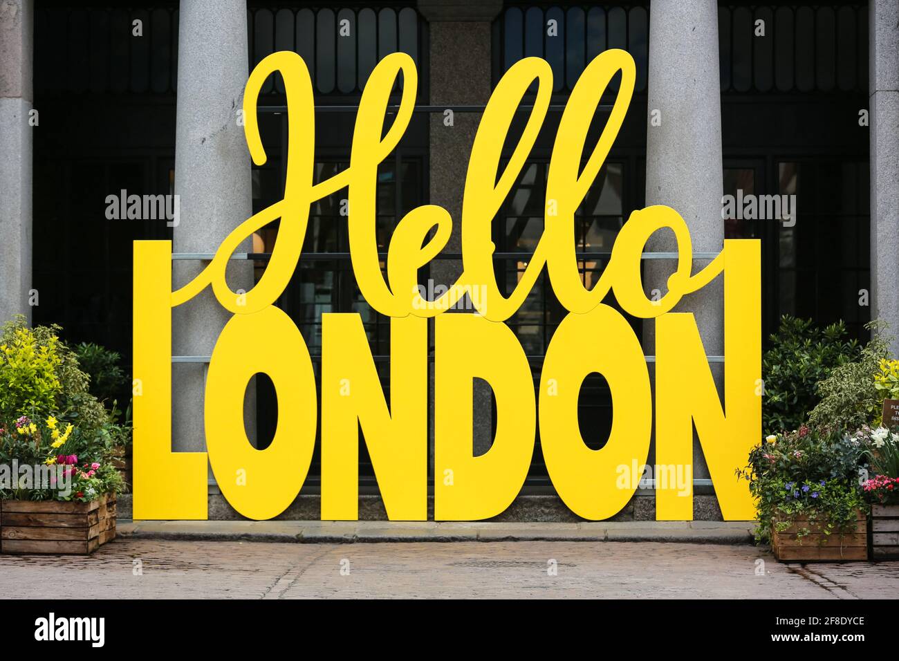 London, UK. 13 April 2021. A yellow Hello London sign welcomes people to Covent Garden. Credit: Waldemar Sikora Stock Photo