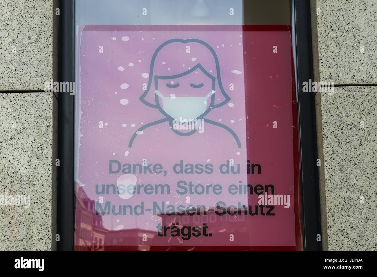 German sign during corona virus telling to wear a face mask for protection during the corona pandemic Stock Photo