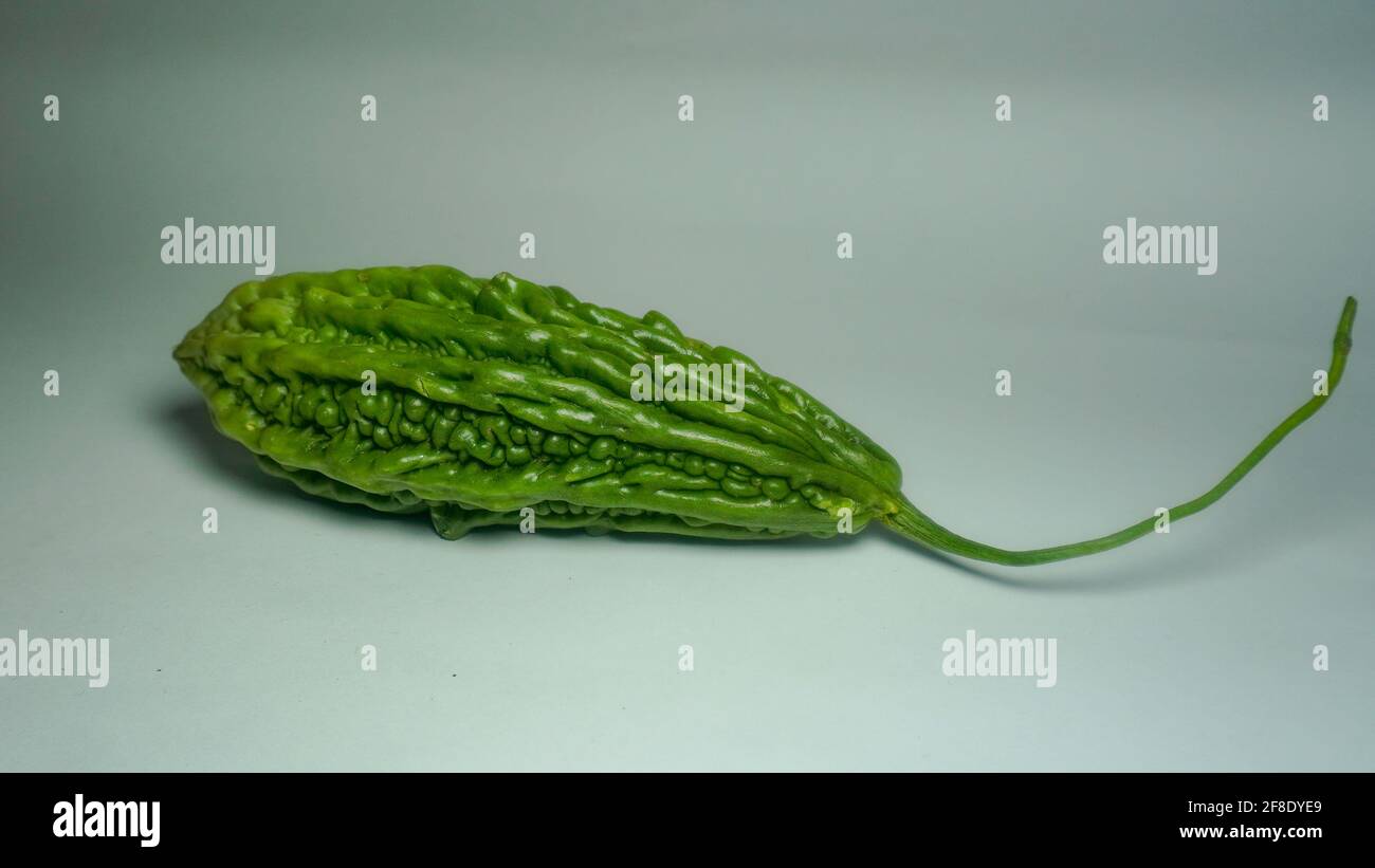 Fresh bitter melon on white. Healthy bitter melon for human body Stock ...