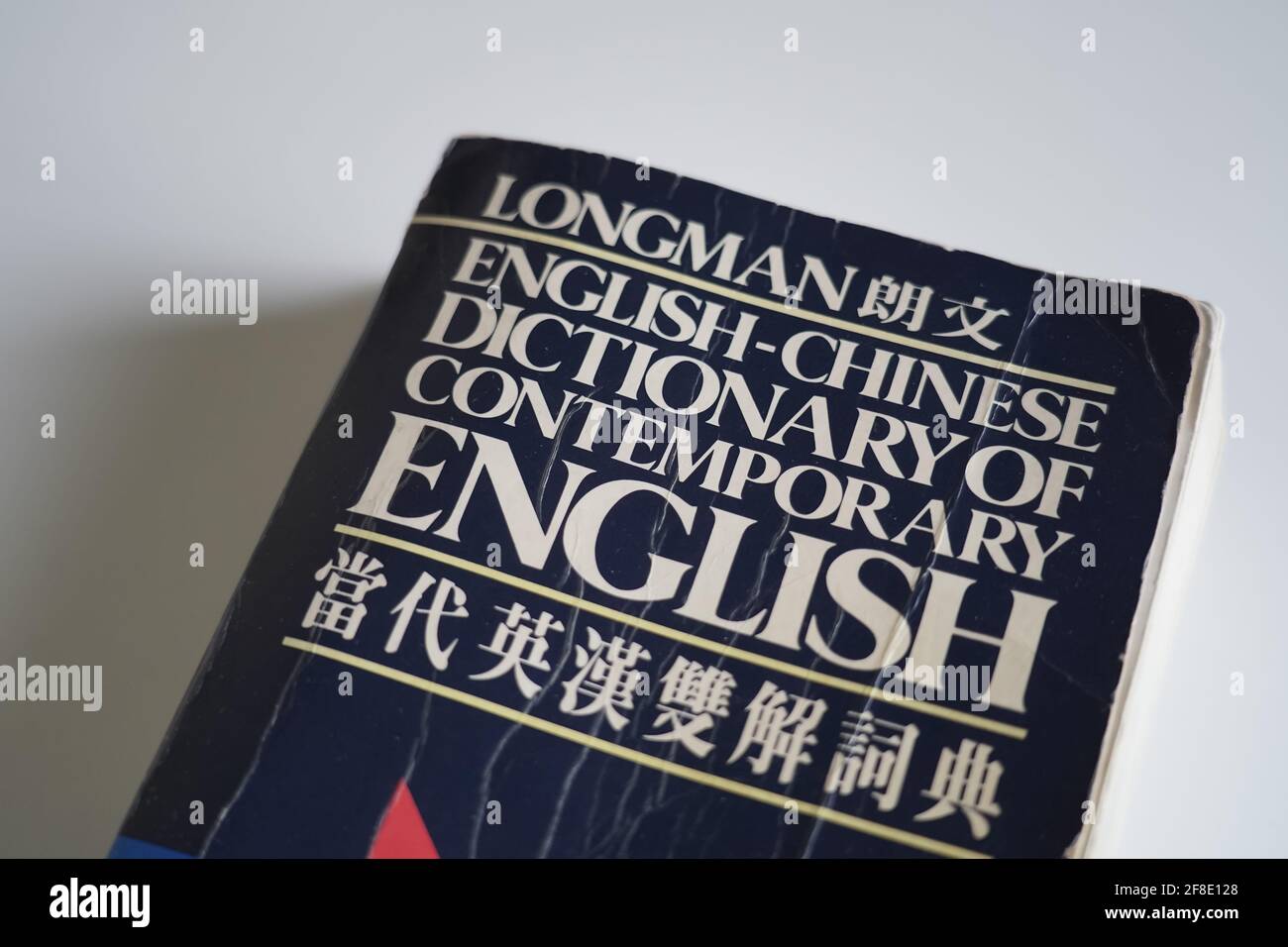 An old wornd out longman english to chinese dictionary Stock Photo Alamy