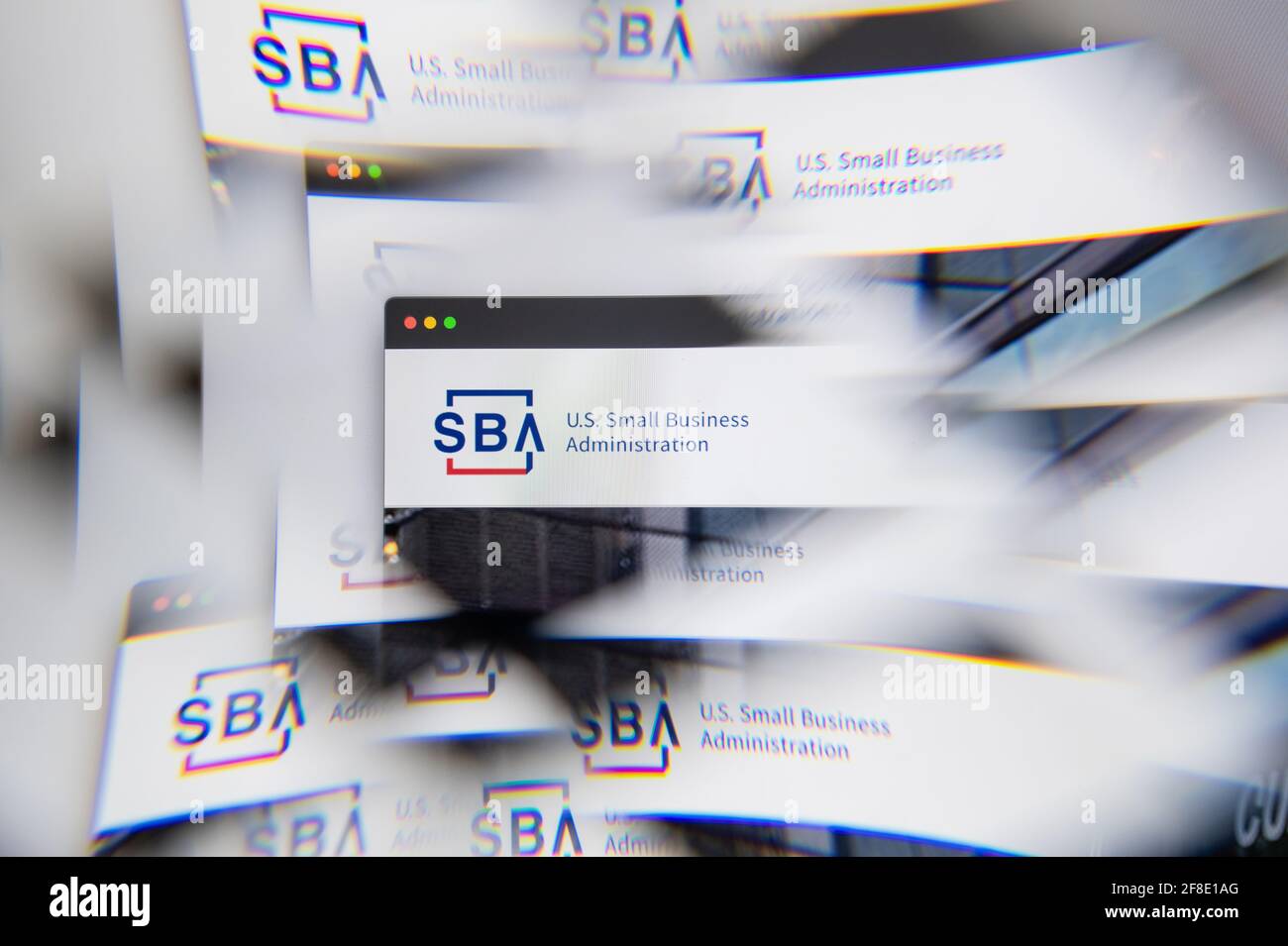 Milan, Italy - APRIL 10, 2021: US Small Business Administration SBA logo on laptop screen seen through an optical prism. Illustrative editorial image Stock Photo
