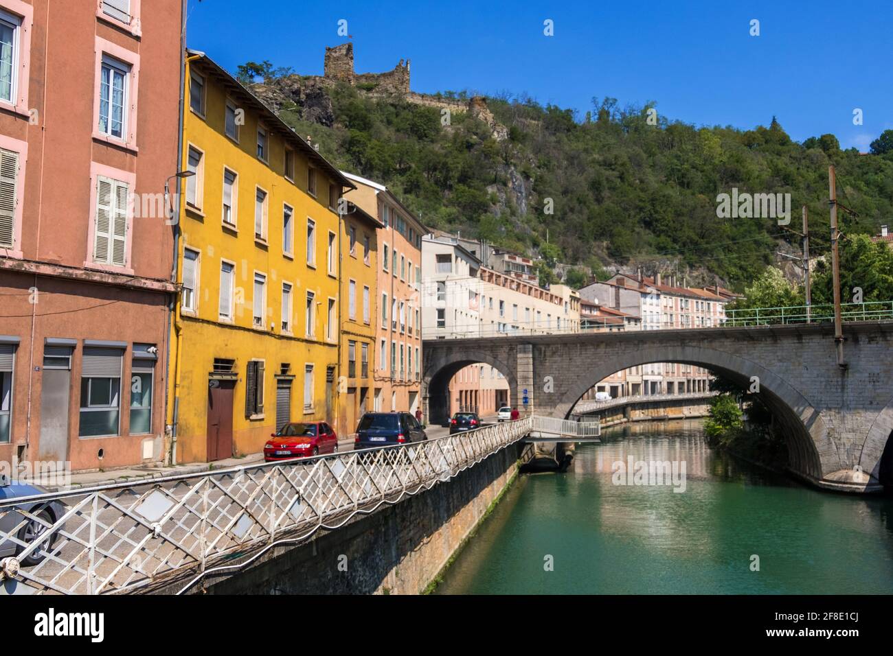 Vienne, France - August 22, 2019: View of the railway bridge over the Gere river and the road along the river in Vienne, Isere department of France Stock Photo