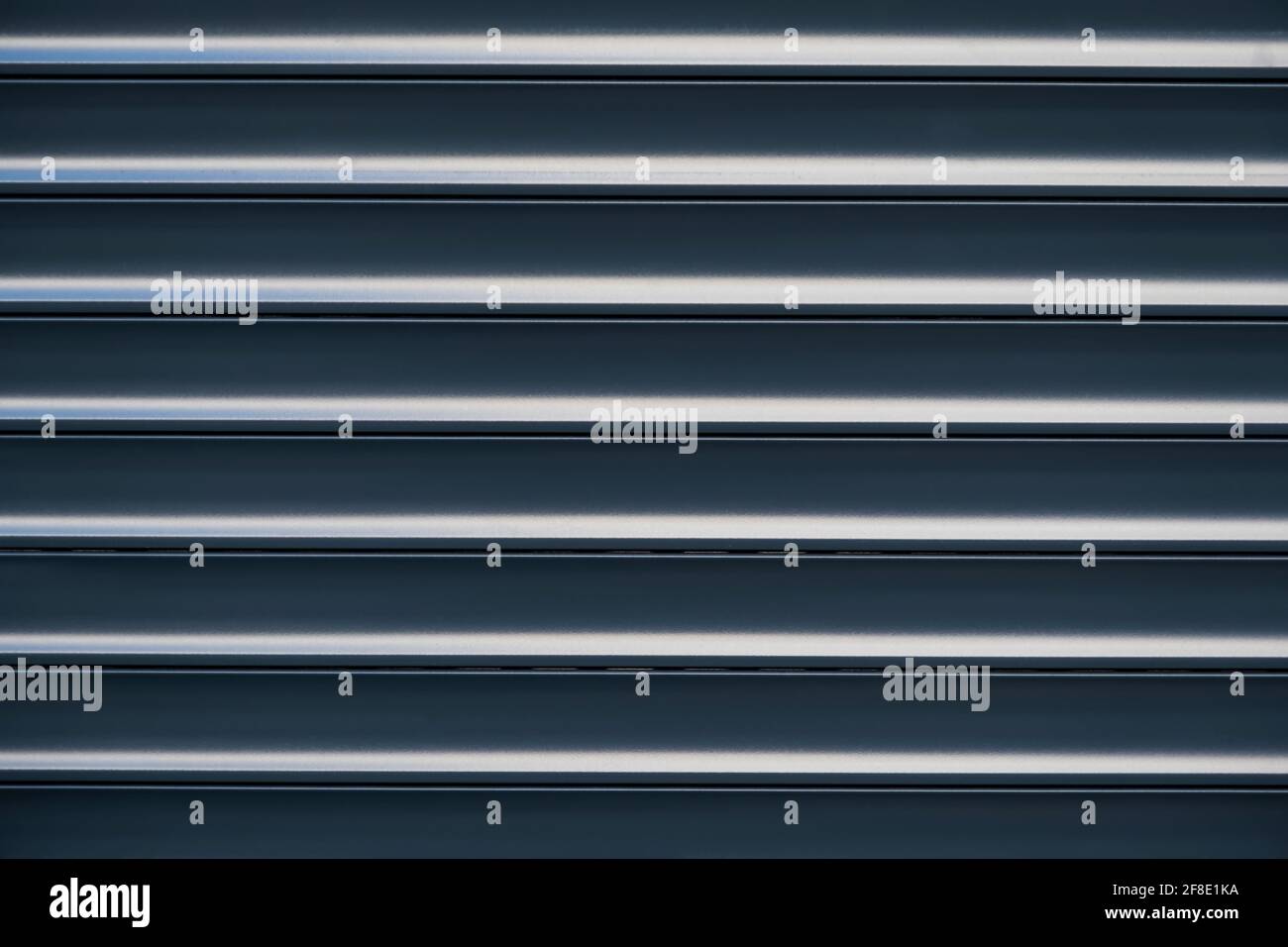 Metallic background. A metal surface with horizontal stripes. Stock Photo