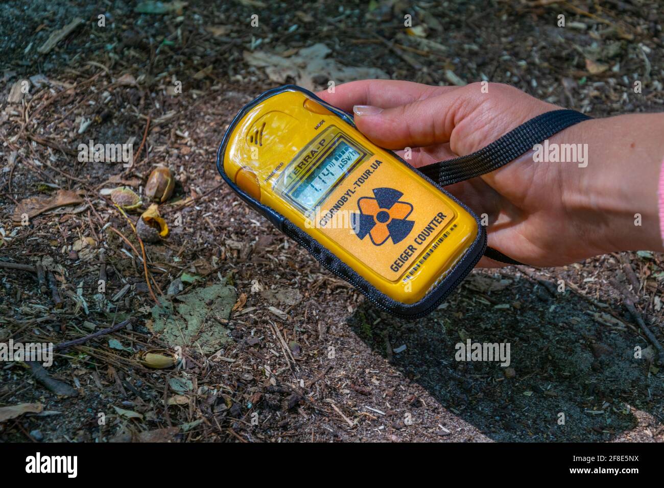 PRIPYAT, UKRAINE, AUGUST 30, 2019 Male hand holding a geiger counter