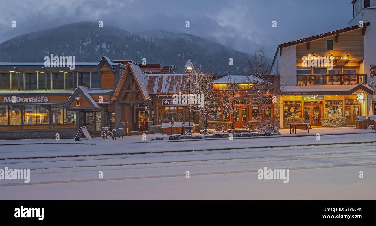 Banff, Alberta, Canada – April 10, 2021:  Exterior view of Banff Avenue businesses during an early morning Stock Photo
