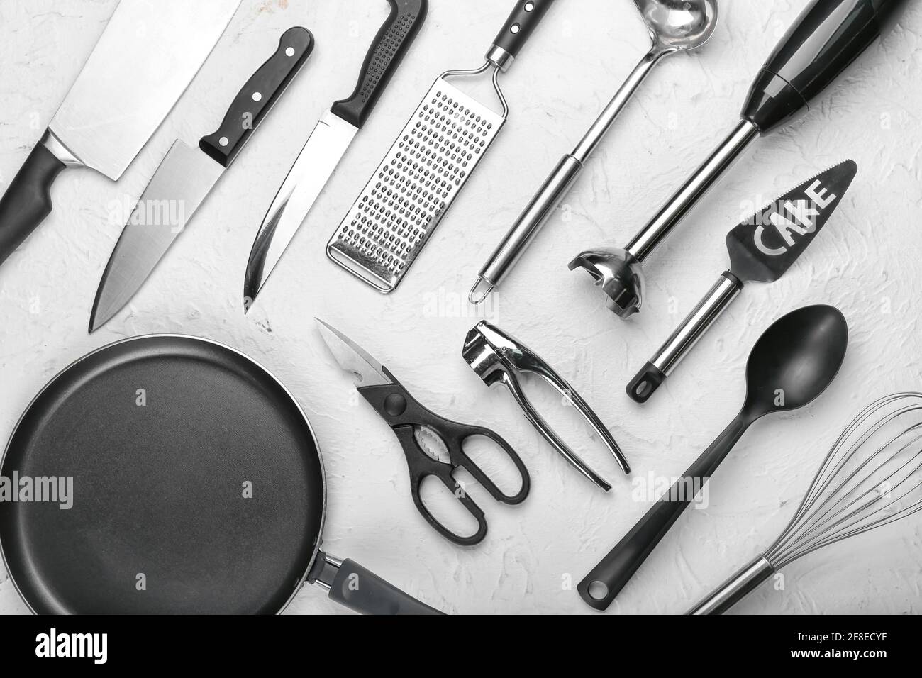 Set of kitchen utensils on light background Stock Photo - Alamy