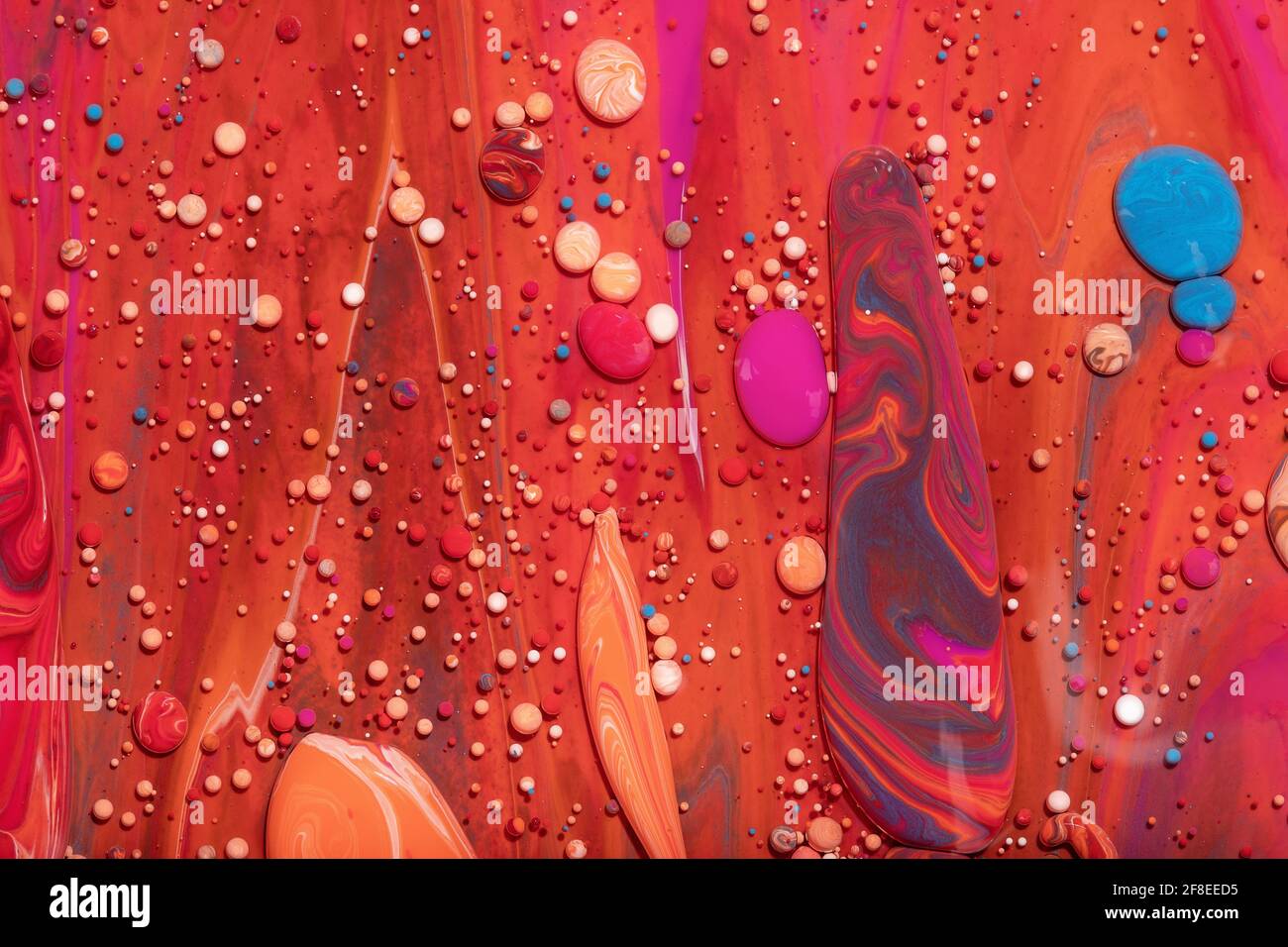 Top view of colorful vibrant rocks on a bright red surface for ...