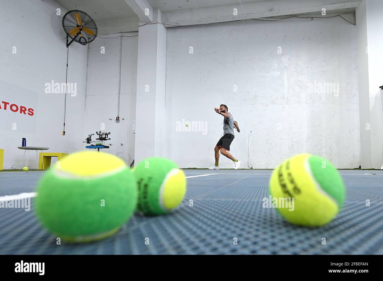 Philip Hinder participates in a tennis class at the Tennis Innovator