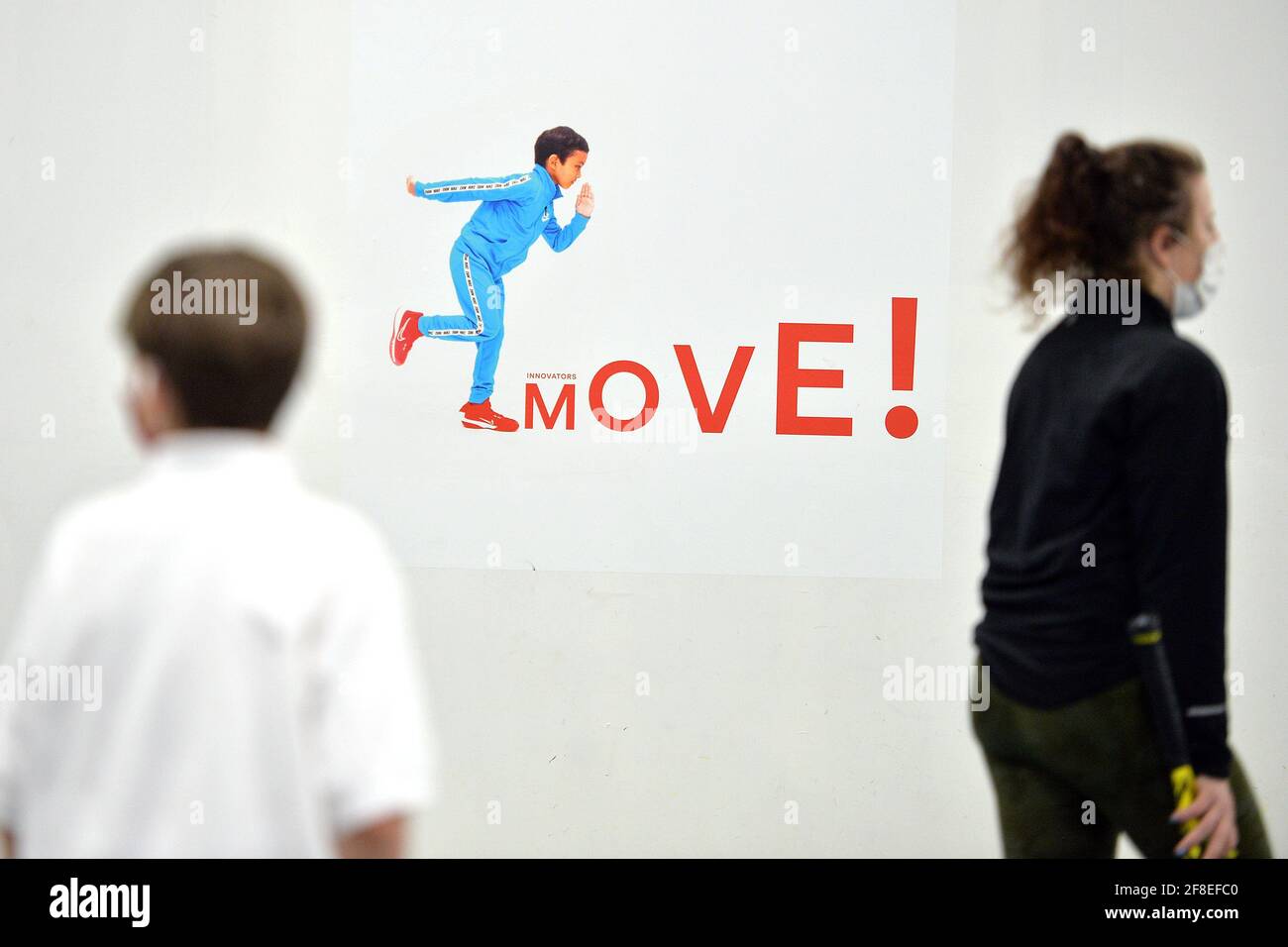 Edward 8 and his tennis coach move through the Tennis Innovator