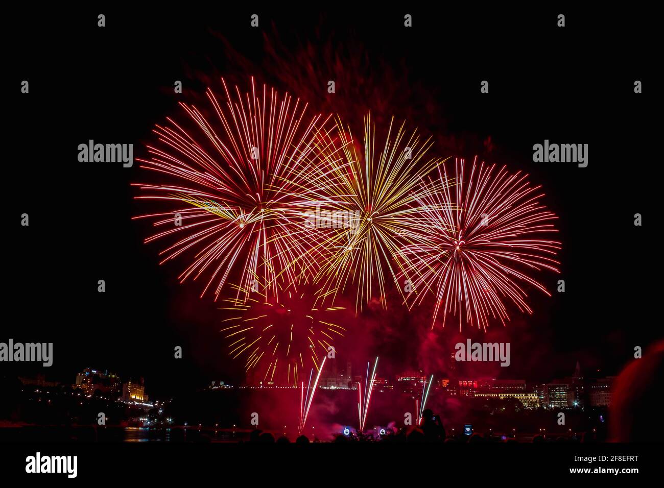 Parliament canada fireworks clock night ottawa party flag hi-res stock ...