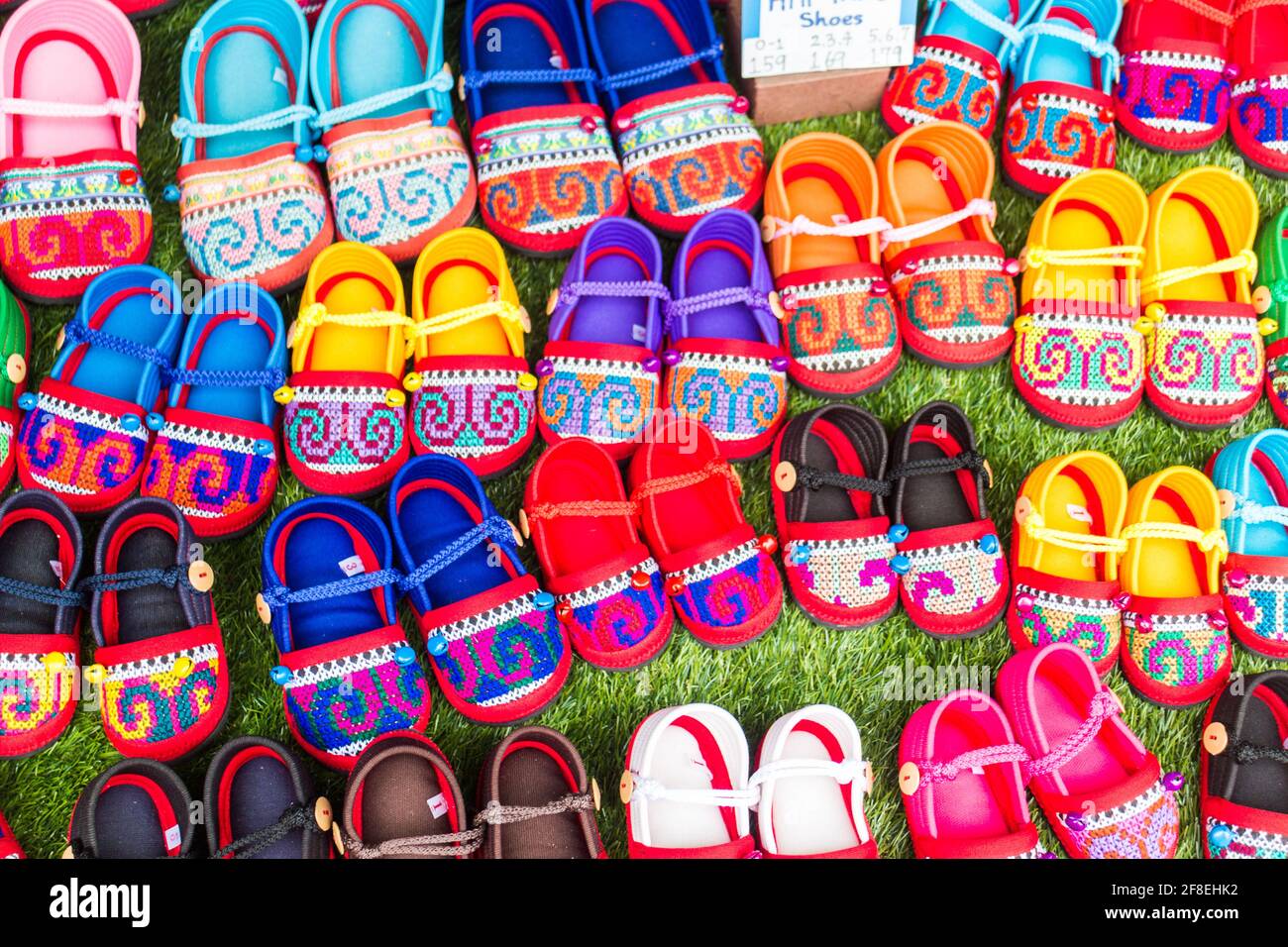 Thai Hilltribe shoes for sale on market stall Stock Photo