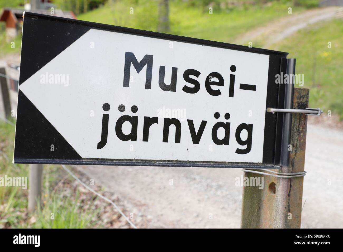 Railway used for heritage railway directional sign in Swedish. Stock Photo