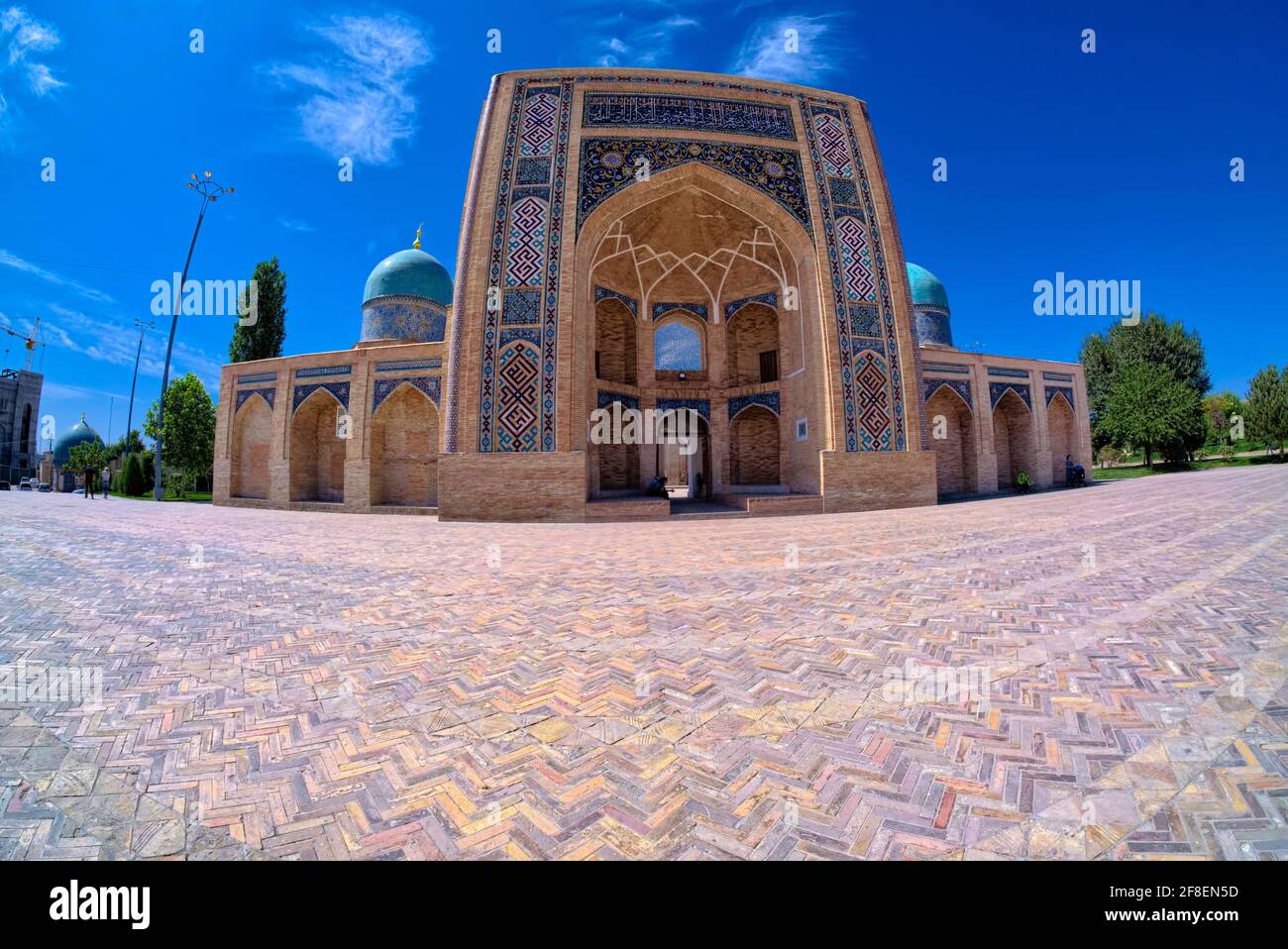 The Madrasah was built of brick and topped with three blue domes. The doors of cells (khudjrs) and the gate of Barak-Khan Madrasah are inlaid with ivo Stock Photo