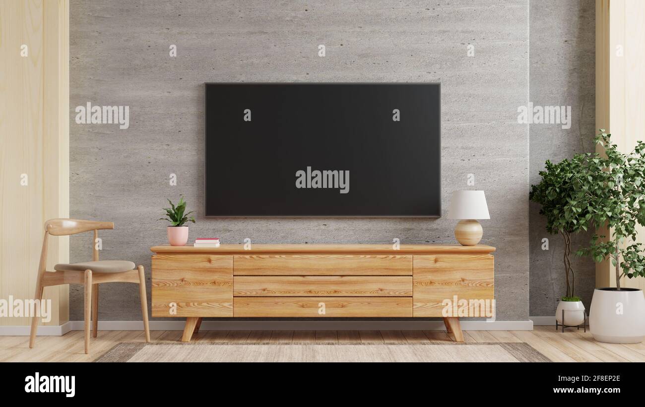 TV wall mount on cabinet the in modern living room the concrete wall,3d  rendering Stock Photo - Alamy