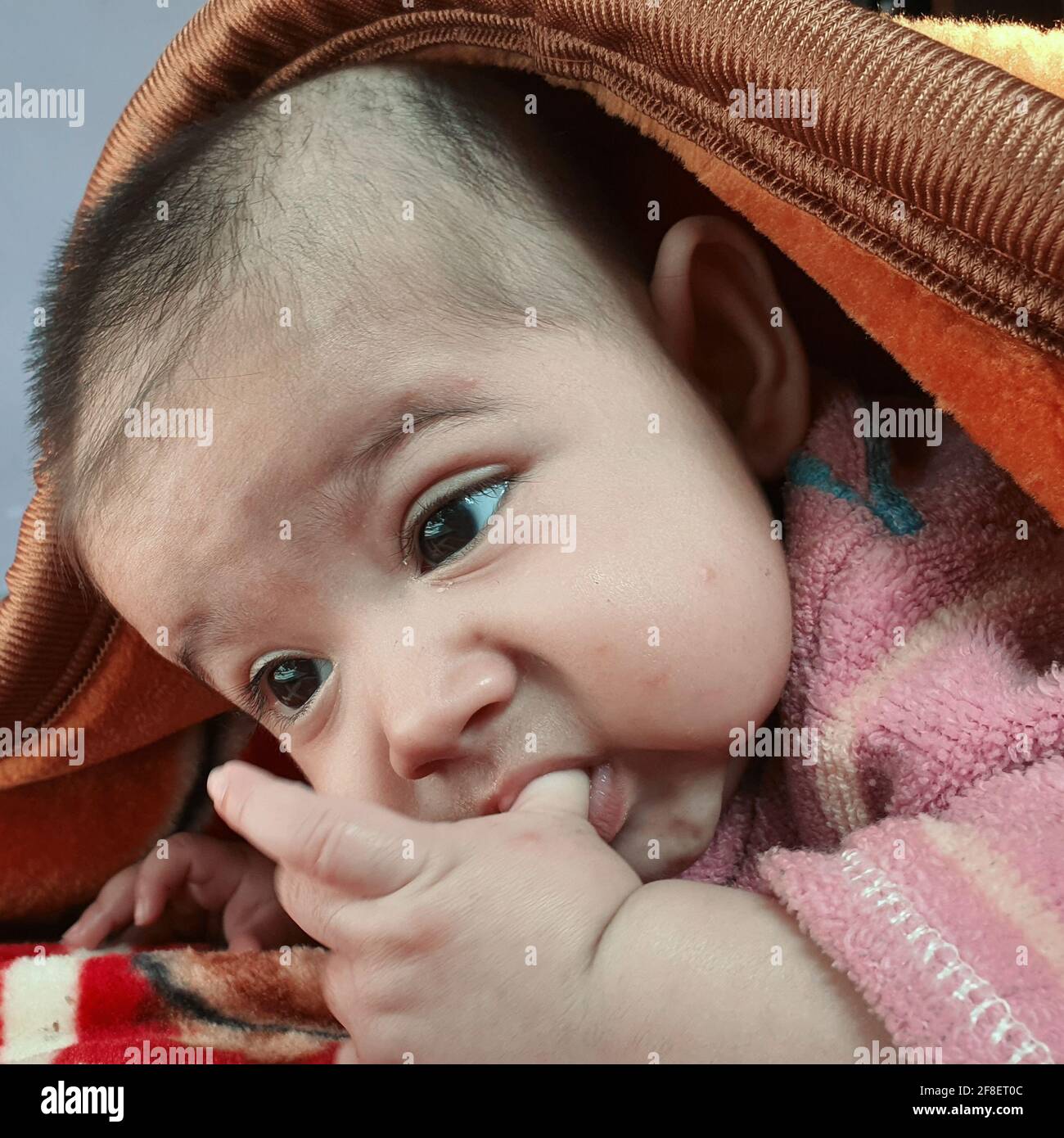 Innocent new born baby kid asian colour looks very beautiful. Stock Photo