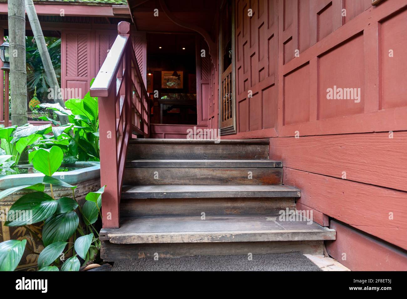 View of staircase leading inside a wooden building at the Jim Thompson ...