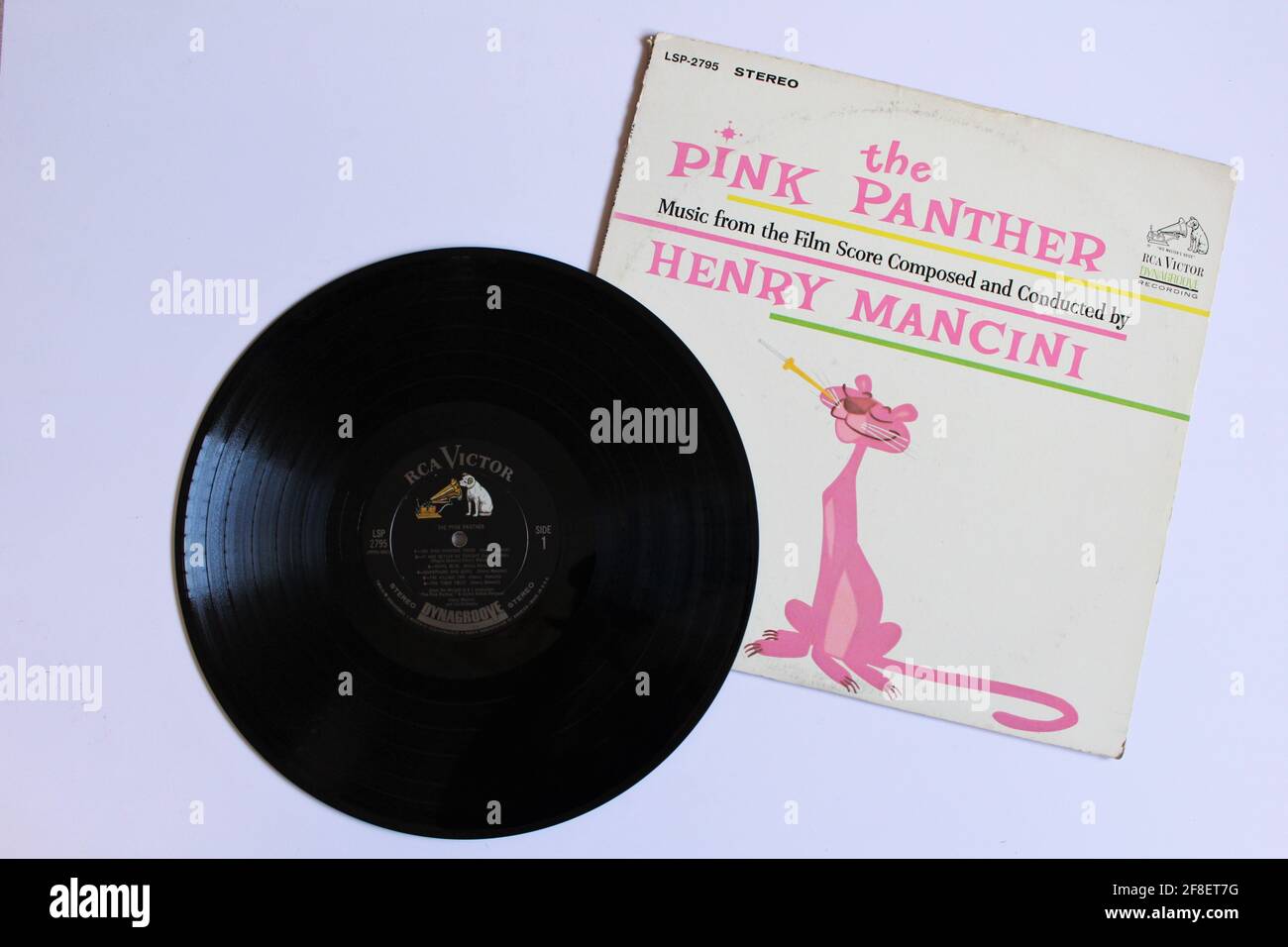 The Pink Panther Theme is an instrumental composition by Henry Mancini written theme for the 1963 film The Pink Panther. Music album on vinyl record Stock Photo