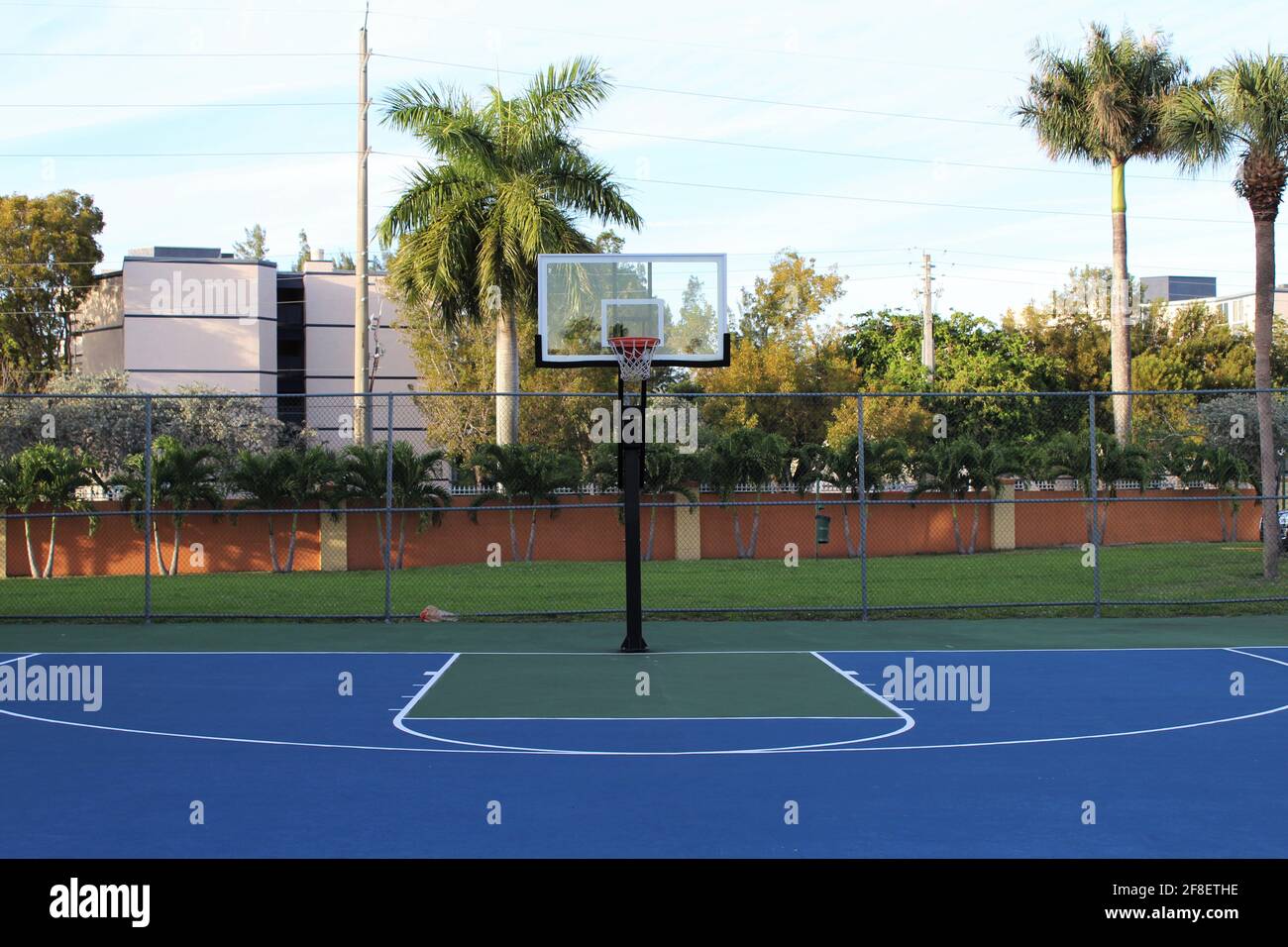 Public Basketball court in the city of Miami, Florida in a housing community where everyone can play ball. Stock Photo