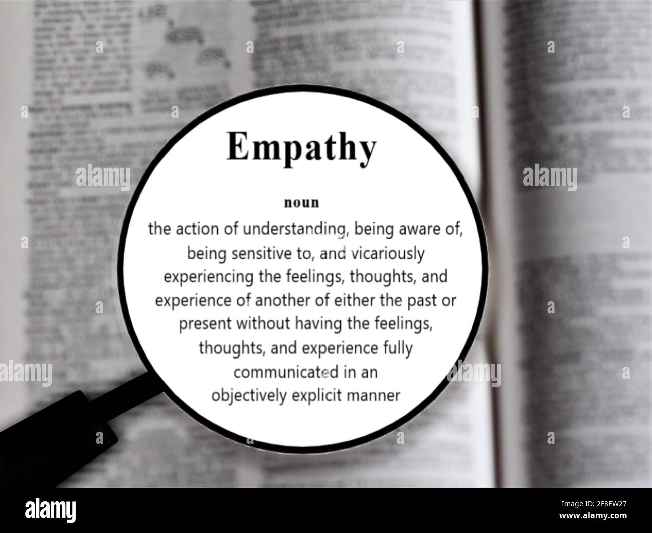 Empathy word in a dictionary. Close up of an English dictionary page with word empathy Stock Photo