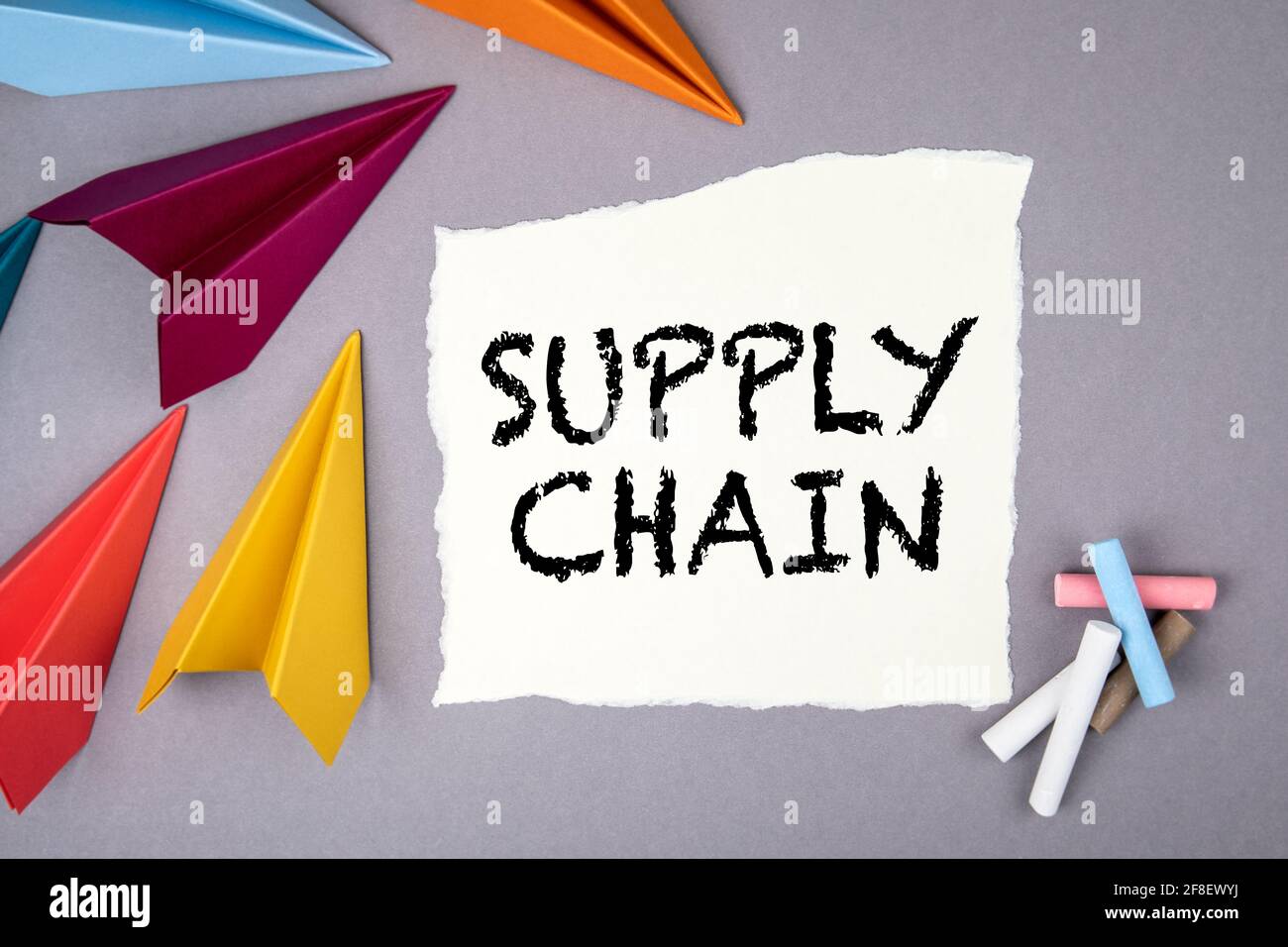 Supply Chain. Paper airplanes on a gray office desk. Stock Photo
