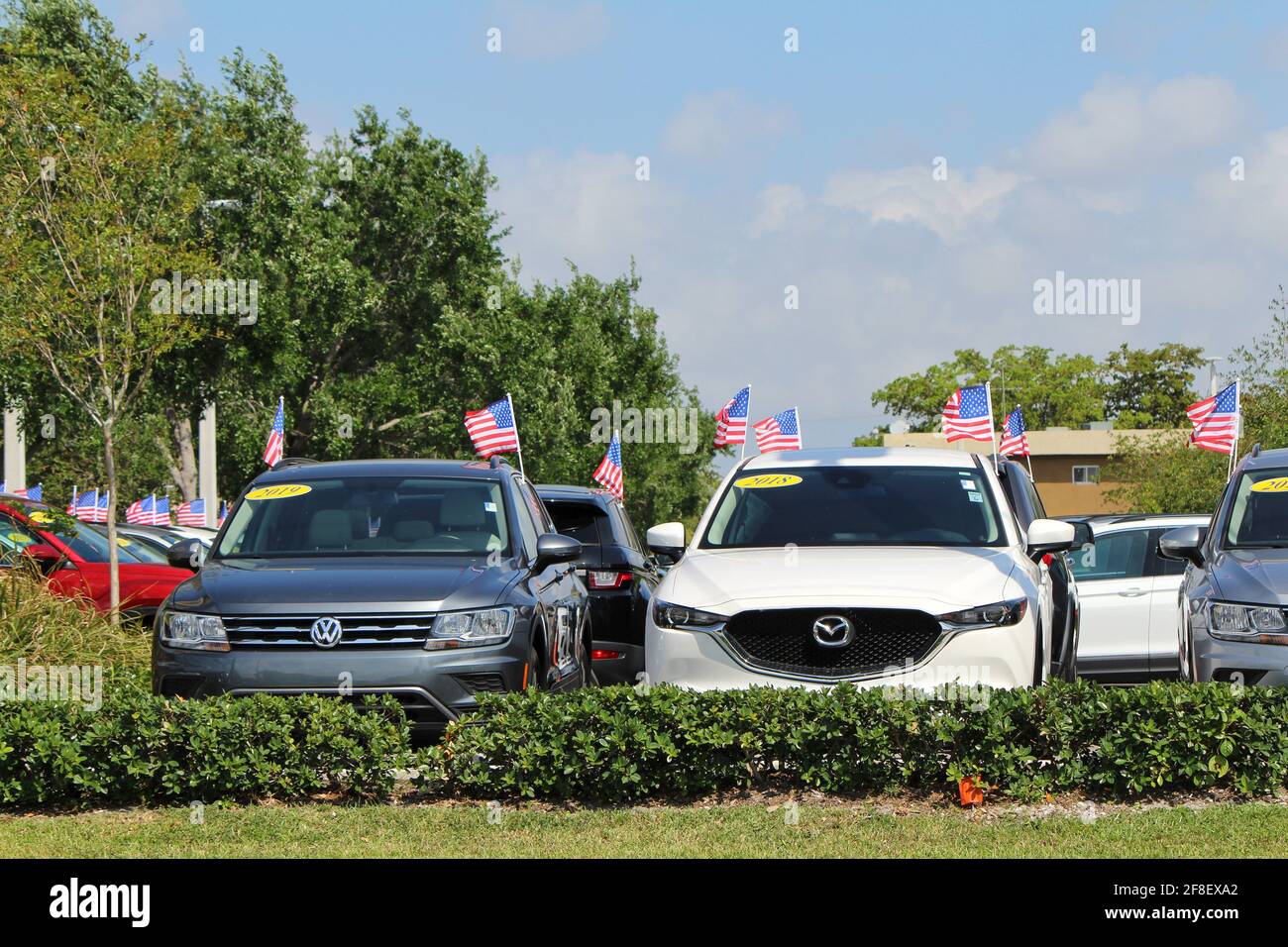 Car lot with cars for sale at a car dealership in south Florida. Stock Photo