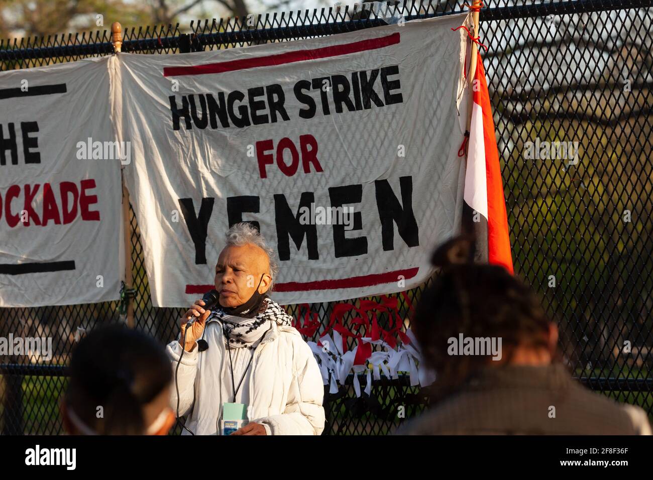 Washington, DC, USA, 13 April, 2021.  Pictured: A woman sings both traditional and more contemporary songs during a vigil, in memory of the many Yemenis who have died as a result of the ongoing war.  The vigil is also in support of those on hunger strike - now in its 17th day - outside the White House, demanding President Biden end the fuel blockade of Yemen.  Credit: Allison C Bailey/Alamy Live News Stock Photo