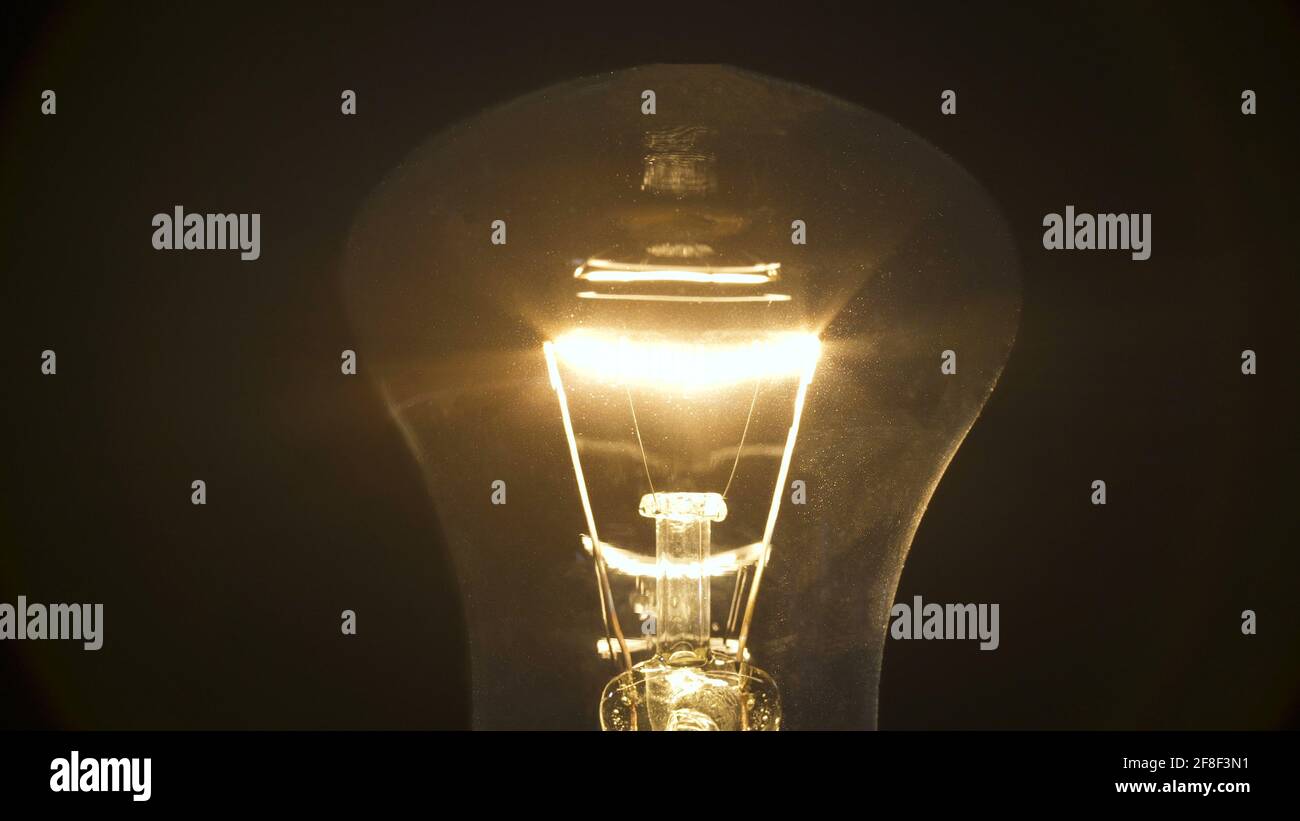 Photo of incandescent bulb on black background Stock Photo
