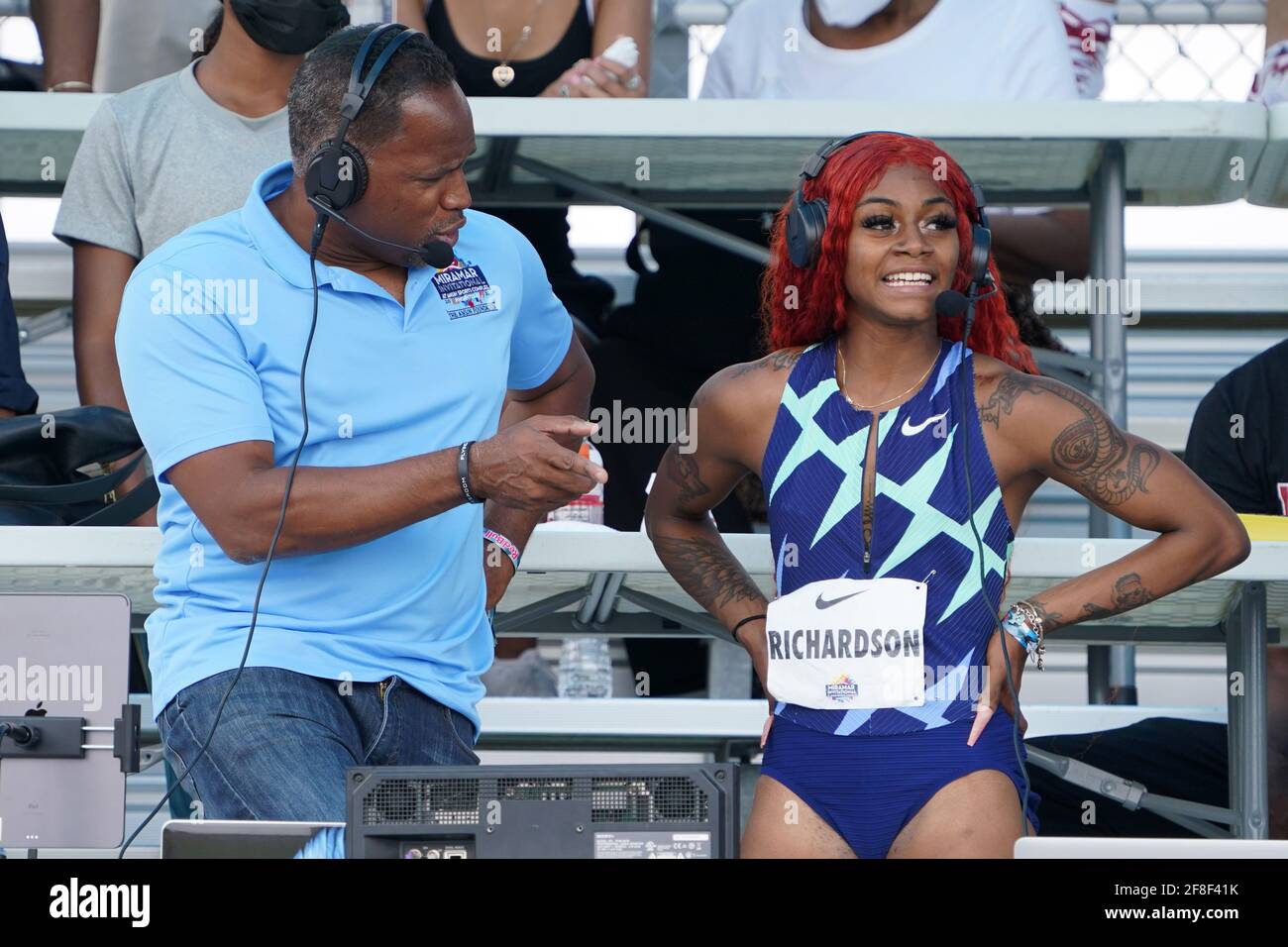 Sha'Carri Richardson (USA), right, is interviewed by NBC Sports broadcasters Ato Boldon after winning the women's 100m in 10.72  during the Miramar In Stock Photo