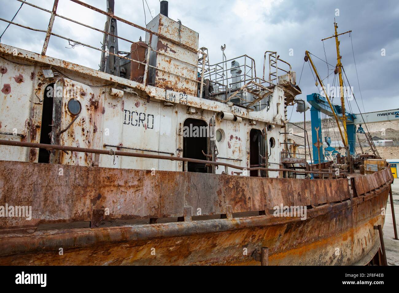 Mangystau, Kazakhstan - May 19, 2012: Old rusted ship on ship-repairing yard. Caspian Sea, Bautino bay. Doors and portholes of deck-office. Stock Photo